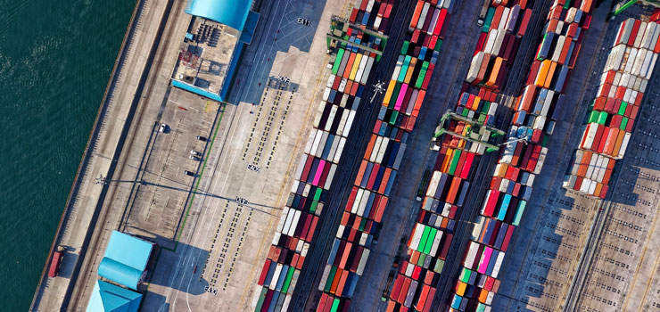 Aerial view of shipping containers at wharf